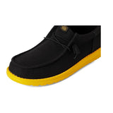 men's low top black sneaker with yellow bottom