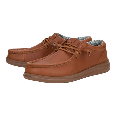 Side view of the Hey Dude Paul Leather Cognac shoe featuring the premium leather finish, easy‑on lace system, and flexible low‑profile sole.