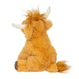 Rear view of Mini Scottie Highland Cow plush showing rust-colored shaggy coat, soft faux fur tail tip, and curved ivory horns.