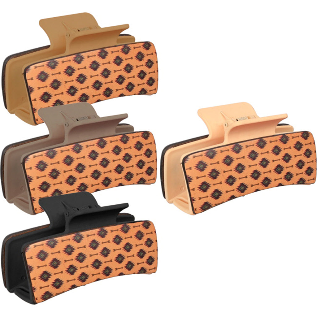 Plastic claw clip with a leather overlay that has Aztec designs and arrows. 