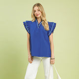 Model wearing a solid ocean blue ruffle scalloped sleeve top, front view showing the scalloped trim, ruffle sleeves, and Western‑inspired feminine style.