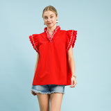 Model wearing a solid red scallop trim ruffle sleeve top, front view showing the scalloped neckline and soft ruffle sleeves