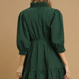 View of the back of the dress, ruffled collar on the back.