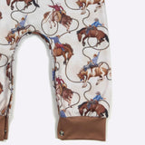 Cream and Brown Romper with Cowboys and Lassos Leg View
