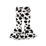 Back view of Girl’s Cow Print Denim Ruffled Flares on a white background with cow print and ruffle hem.