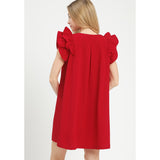Back view of model wearing a red seersucker ruffle sleeve shift dress showing the smooth back and easy, flowy fit.