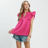 Model wearing the Fuchsia Textured Ruffle Sleeve V‑Neck Top, showing the layered ruffle sleeves and textured fabric.