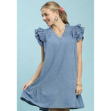 Front view of model in chambray ruffle babydoll dress untied with soft denim look.