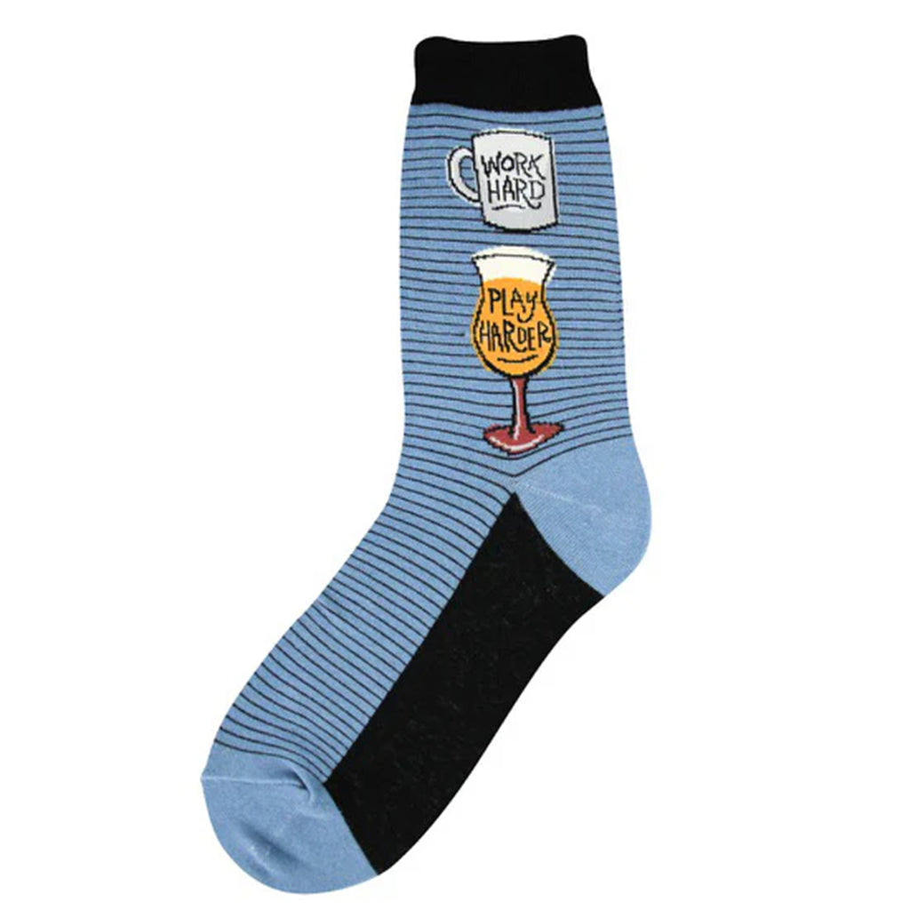 Flat lay of single sock, its blue and black striped with work hard play harder on beer & Wine glasses. 