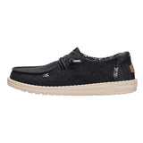 Toe to heel side view of Hey Dude Wendy Black Floral Boho Shoes 