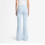 A mid-rise wide-leg light wash jean with pink 7 stitched on back pockets