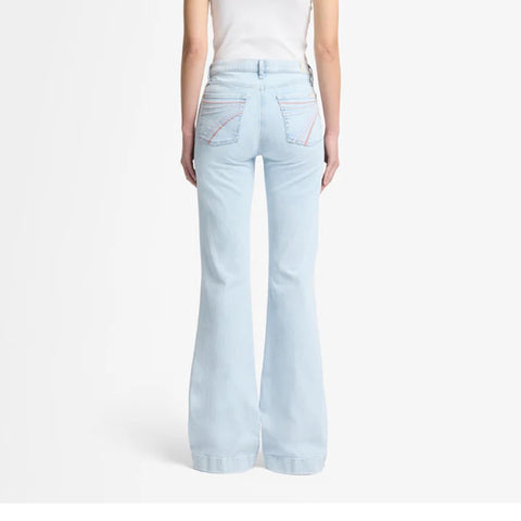 A mid-rise wide-leg light wash jean with pink 7 stitched on back pockets