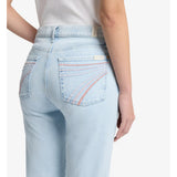 A mid-rise wide-leg light wash jean with pink 7 stitched on back pockets