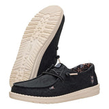 Side and bottom view of Hey Dude Wendy Black Floral Boho Shoes 