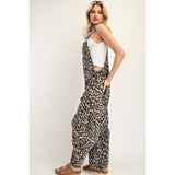 Woman wearing the Leopard Barrel Leg Jumpsuit, side angle highlighting the barrel‑leg shape and comfortable, relaxed drape.