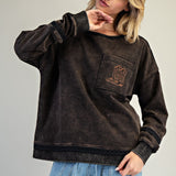 Black faded sweatshirt with a brown stitched boot on the chest pocket.