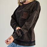 Side of the sweatshirt, bottom, shoulders, and cuff have black lace detailing. 
