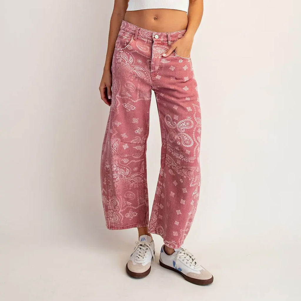 Faded red bandana print barrel jeans.