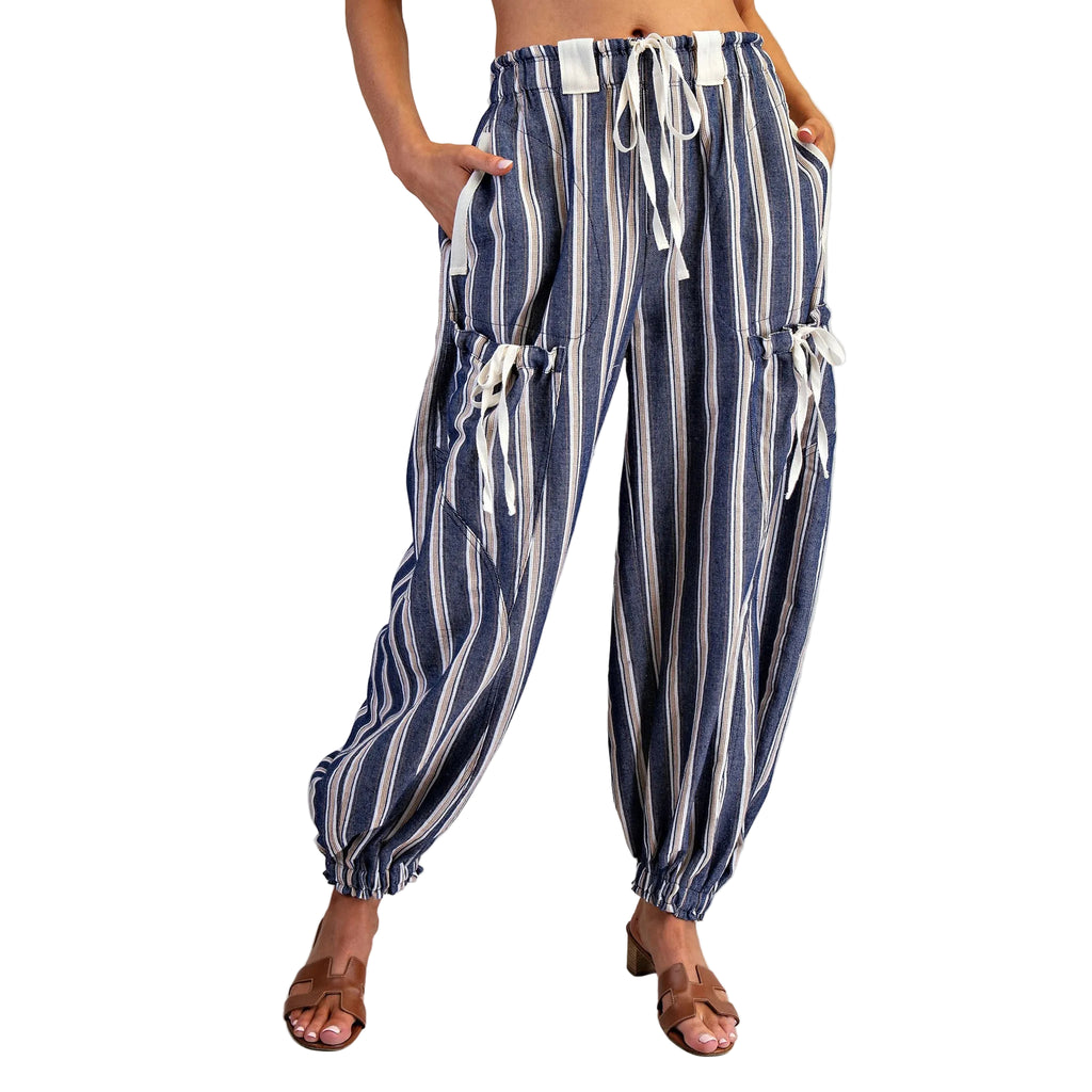 Model wearing navy and gray striped pants in a front view, showing the relaxed fit, vertical stripe pattern, and lightweight everyday fabric.