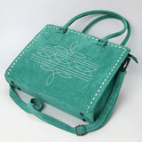 Lay down view of 4 metal small peg legs on bottom of purse