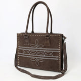 brown suede tote style purse with white boot stitching and brown and white stitched shoulder strap