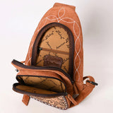 Open pocket view of bag. 1 large zipper pocket with small zipper pocket inside. 1 medium zipper pocket