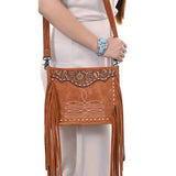 Styled view of dark tan purse with white stitching - matching side fringe - tooled top piece