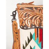 close up of strap and tooling on purse