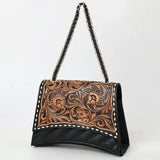 side view of black and floral tooled purse with black and gold chain strap