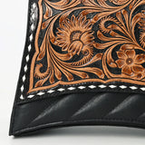 close up of floral tooling on purse