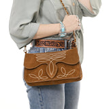 Styled photo with Brown and white boot stitch flop closure purse with chain strap 