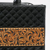 close up of diamond design stitching and floral tooling