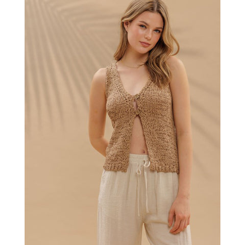 Front view of Sand colored crocheted vest with two top buttons.