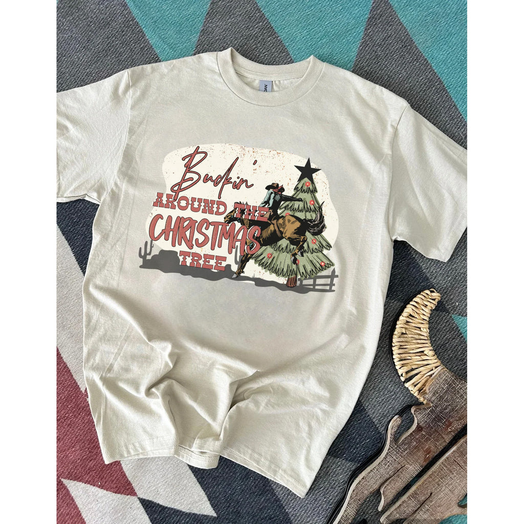 white women's crewneck t shirt with buckin' around the Christmas tree graphic on front