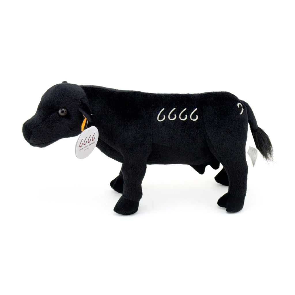 Black angus stuffed toy with yellow ear tag and 6666 brand on the side. 