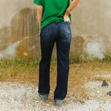 Back side view of dark wash line drive jeans. 