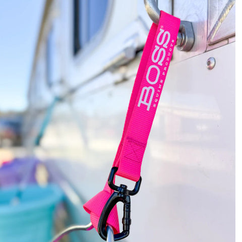 Pink bucket strap with white Boss equine logo.
