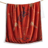Orange/Black/Yellow Throw featuring line-heavy illustrations of wrangling cowboys, horseshoes, skulls and desert plant life