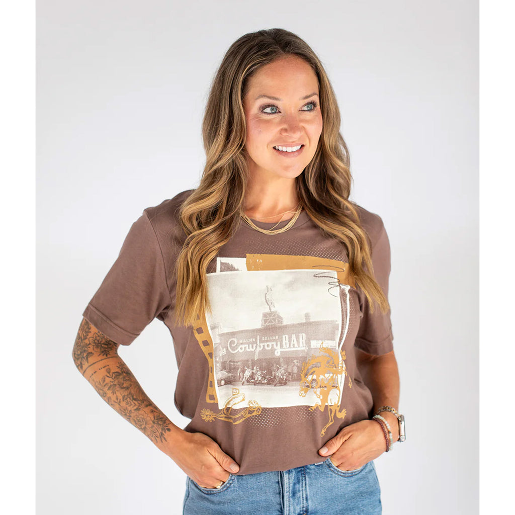 women's brown short sleeve t shirt with cowboy bar graphics on front
