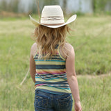 Back view of girl wearing multi serape striped tank top in a field