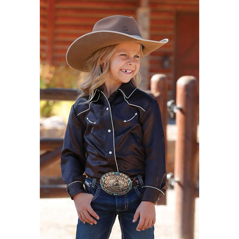 Front view of girl’s brown satin shirt with pearl snaps and Western yoke detailing