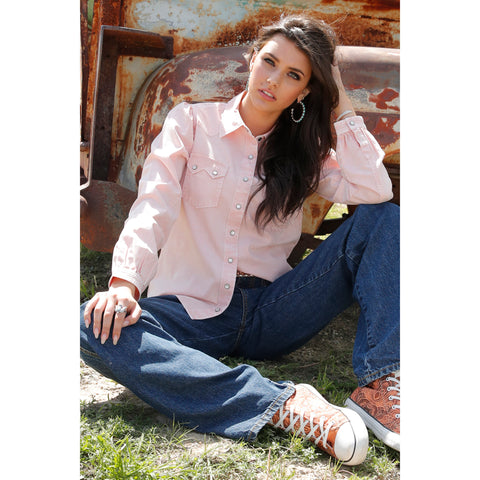 Baby pink long sleeve pearl snap women's shirt.