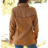 women's tan jacket with black whip stitch yoke details on back