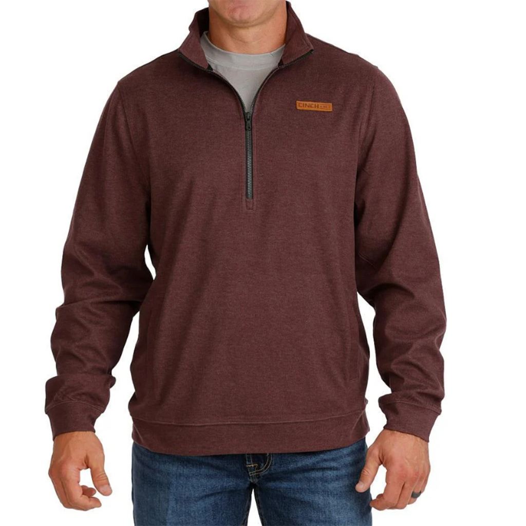 purple with half zipper, side pockets, leather cinch patch on chest 