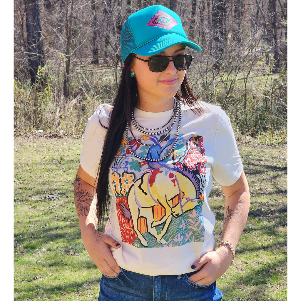 Colorful bronc rider design on a natural colored t shirt.