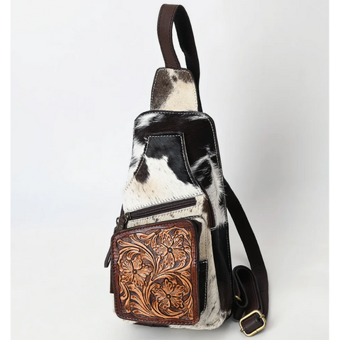 Black and white hide sling bag with tooled pouch