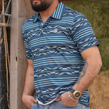 Full front and side view of male model wearing the deep blue polo. 