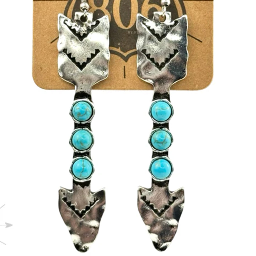 Long arrow earrings with three turquoise stones in the middle of the shaft.