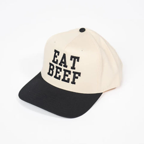 Cream colored hat with black bill and black embroidered "EAT BEEF".