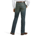Back view of Ariat M5 Legacy Swagger Jeans in medium wash, showing slim fit, straight leg, and boot-ready styling